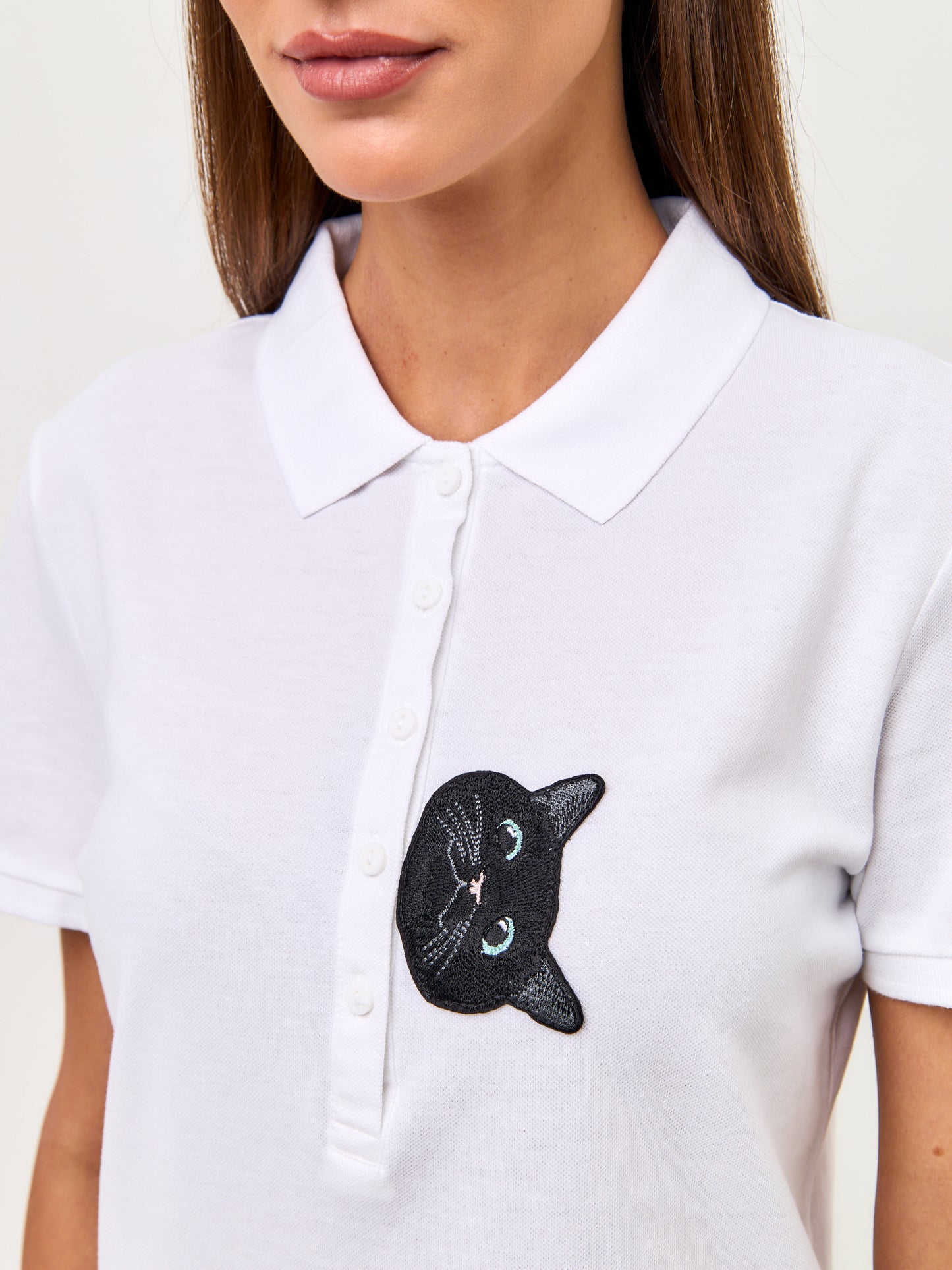 Set: women's white polo shirt with a black cat and black wide-leg sweatpants - Maniita Lacitta